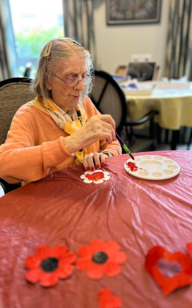 resident painting poppies