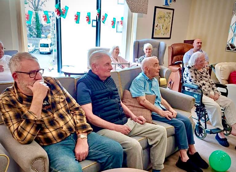 Our residents watching our St Davids Day entertainment singers at Ty Llandaff Care Home